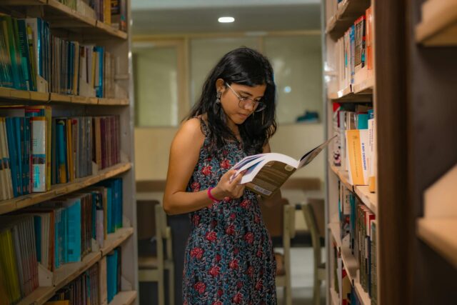 woman in dress at library