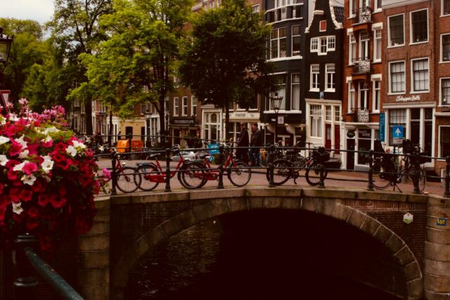 photo of bicycles near bridge at daytime